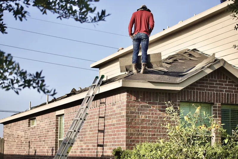 Professional roofer working on a residential roof in Eastern Goleta Valley